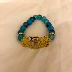 “LOVE” bracelet.